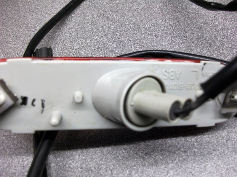 REAR INDICATOR LIGHT WITH RED LENS LEFT HAND