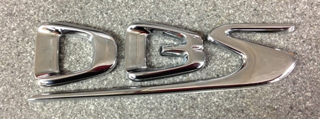 Image of DBS SIDE FENDER WING BADGE LEFT HAND