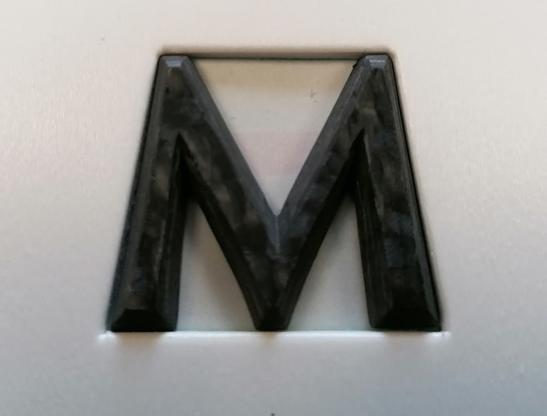 Image of REAR ASTON MARTIN SCRIPT BADGE - CARBON