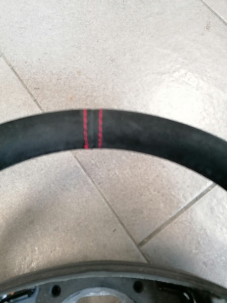 Image of ALCANTARA STEERING WHEEL WITH DOUBLE RED STITCHING
