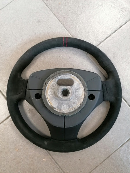 Image of ALCANTARA STEERING WHEEL WITH DOUBLE RED STITCHING