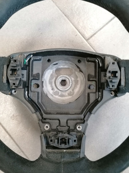 Image of ALCANTARA STEERING WHEEL WITH DOUBLE RED STITCHING