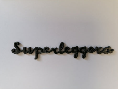 Image of CARBON FIBRE SUPERLEGGERA SCRIPT NAME BADGE