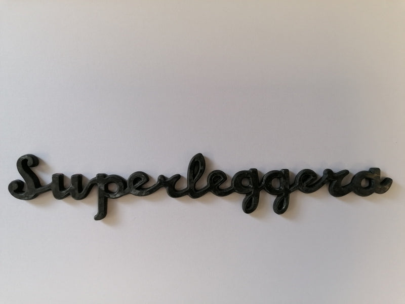 Image of CARBON FIBRE SUPERLEGGERA SCRIPT NAME BADGE