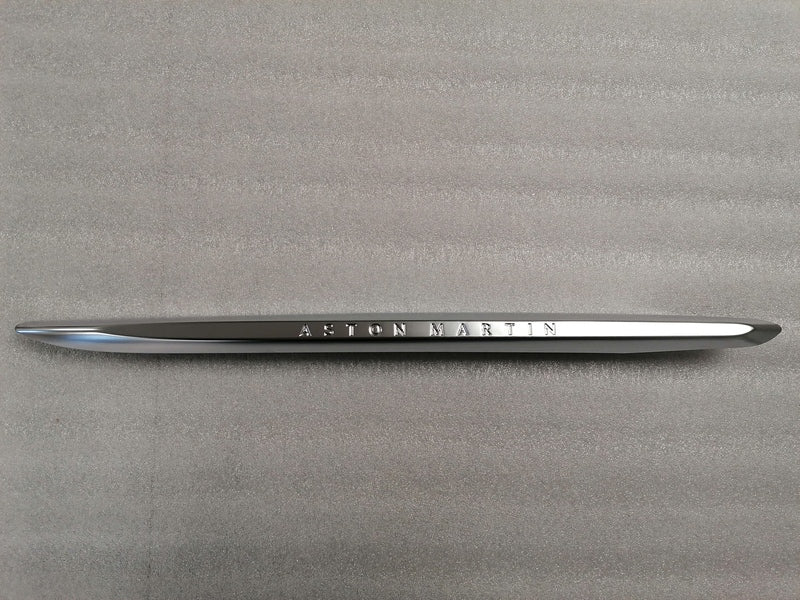 Image of LEFT FRONT WING FENDER CHROME STRAKE WITH THE ASTON MARTIN INSCRIPTION