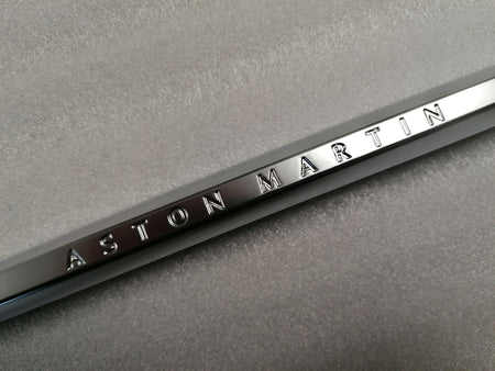 Image of LEFT FRONT WING FENDER CHROME STRAKE WITH THE ASTON MARTIN INSCRIPTION