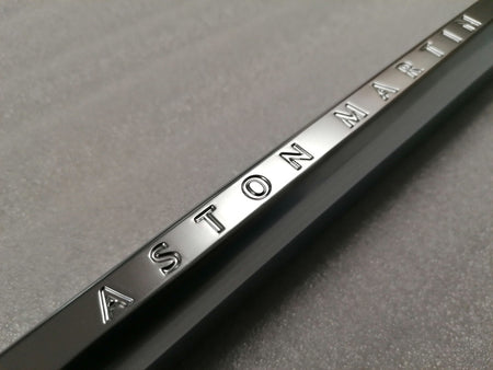 Image of LEFT FRONT WING FENDER CHROME STRAKE WITH THE ASTON MARTIN INSCRIPTION