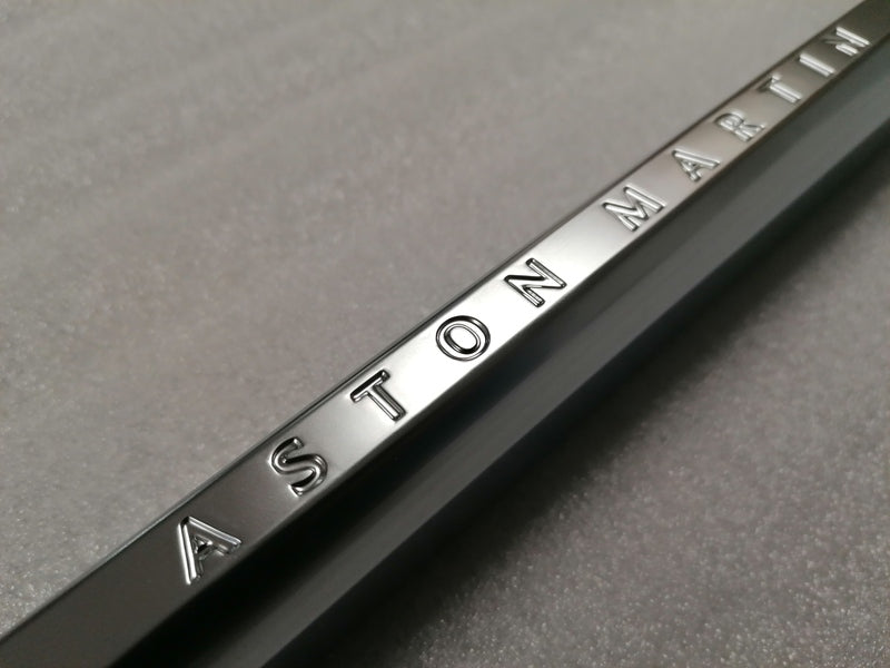 Image of LEFT FRONT WING FENDER CHROME STRAKE WITH THE ASTON MARTIN INSCRIPTION