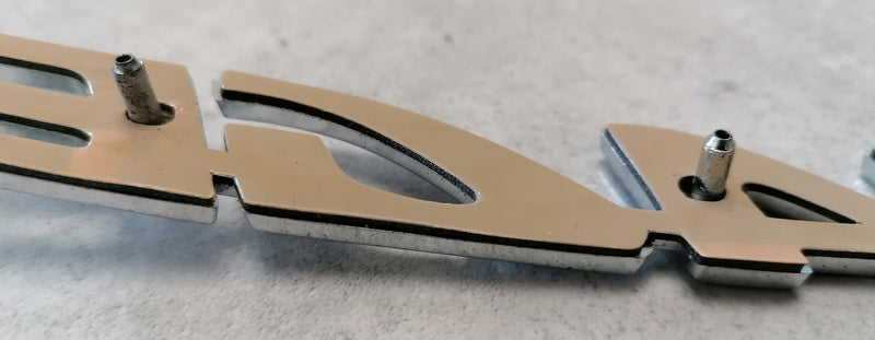 Image of REAR CHROME VANTAGE BADGE