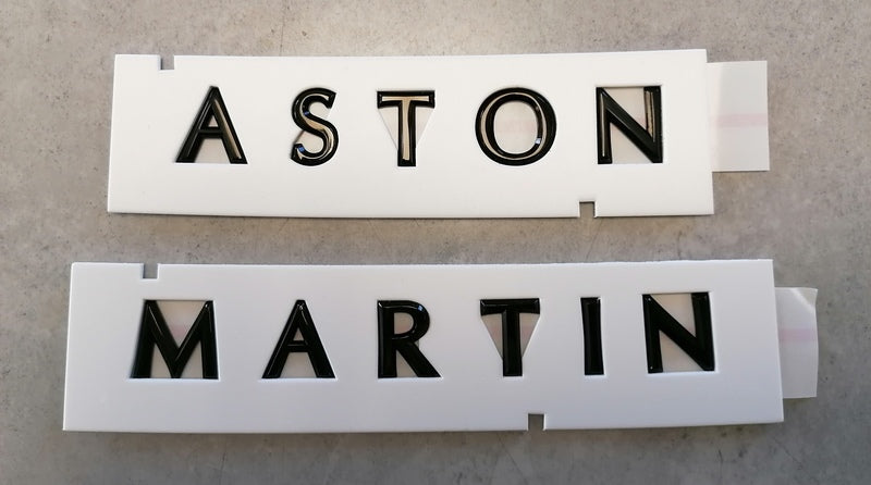Image of REAR ASTON MARTIN LARGE SCRIPT BADGE - BLACK
